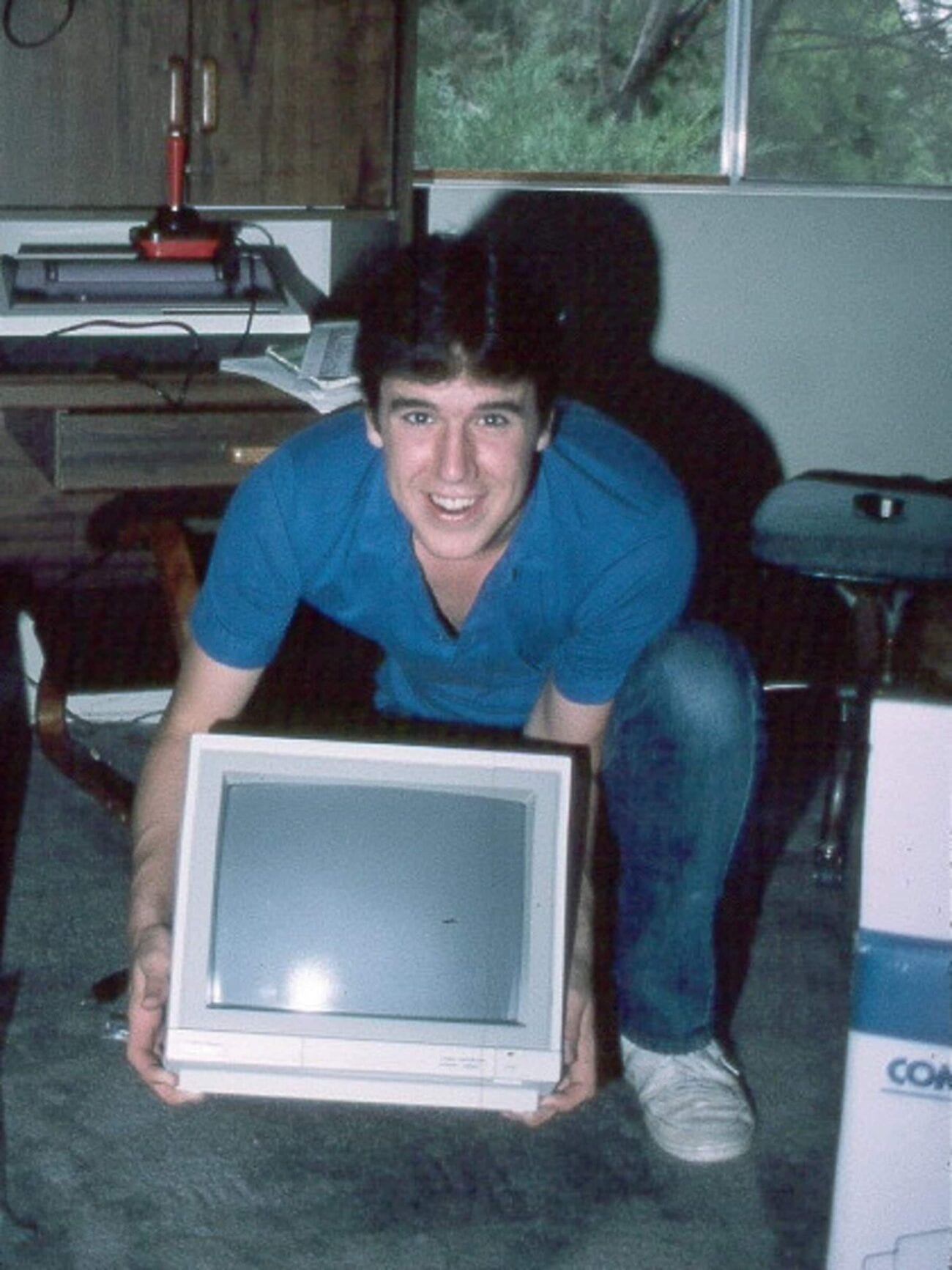 Terry in the early 90s holding a monitor